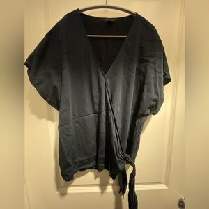 Banana Republic size XL. Navy blue blouse, criss cross top with tied bottom.